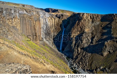 Hengifoss is the second highest waterfall on Iceland. The most special thing about the waterfall are multicolored layers in the basalt rock.
