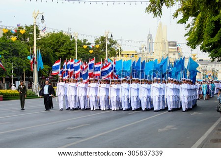 BANGKOK, THAILAND - AUGUST 12: Cadets of the Royal Thai Army, Navy, Air Force, and Police hold flag in mother\'s day celebration parade on August 12, 2015 in Ratchadamnoen Klang road, Bangkok, Thailand