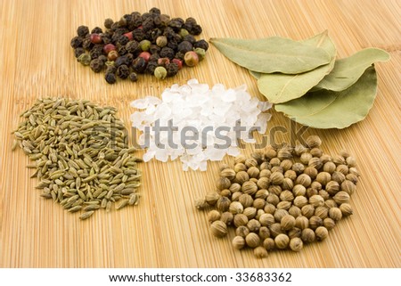 Five different spices on bamboo background
