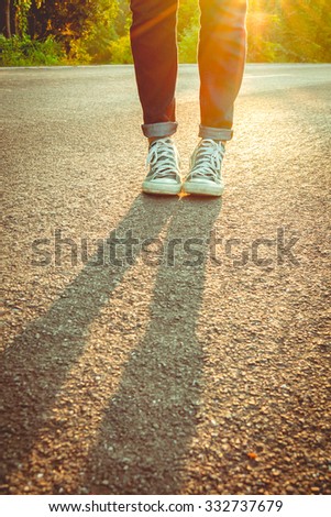sneakers walking on floor,sneakers with sunset