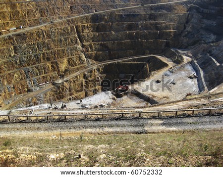 Mine gold and silver with machinery working at the base