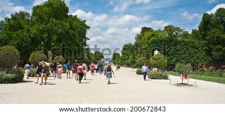 Paris, France - July 7, 2011 - Both Parisians and tourists enjoy a sunny afternoon at the Tuileries Garden (Jardin des Tuileries) in Paris.