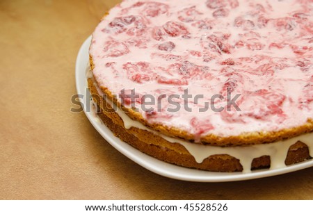 homemade strawberry cake on a platter with natural background