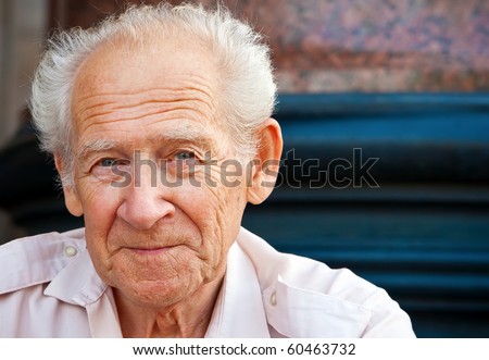 face portrait of a cheerful smiling senior man