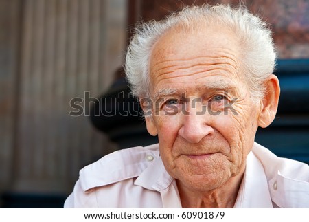 face portrait of a cheerful smiling senior man