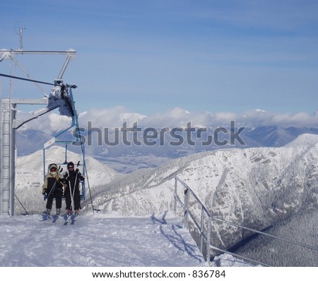 A couple on a ski lift