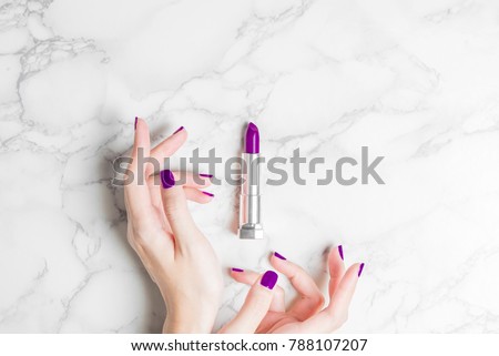 woman hand with beautiful purple  ultra violet nail and lipstick minimal modern stylish