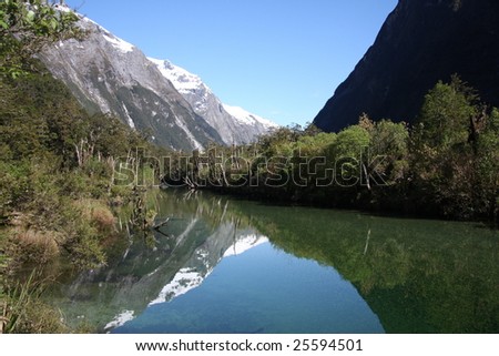 mountains reflecting in the water