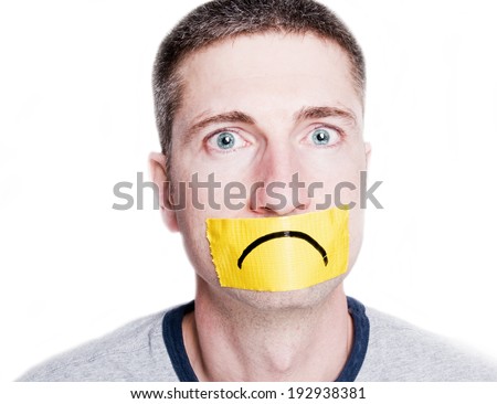 Adult man with duct tape frown on face