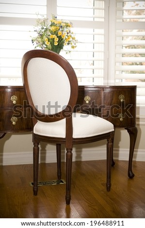 A antique style chair and matching dressing table.