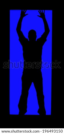 Silhouette of a man assuming the hands up pose.
