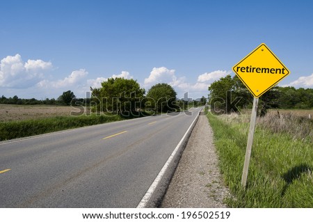 A two lane road with a sign on the side of the road that says retirement.