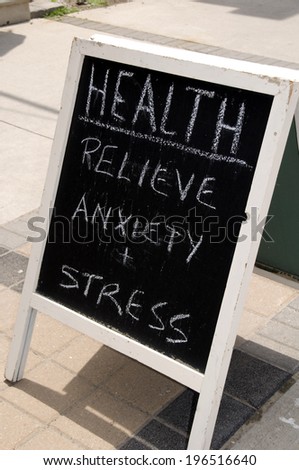 A sign outside about relieving anxiety and stress.
