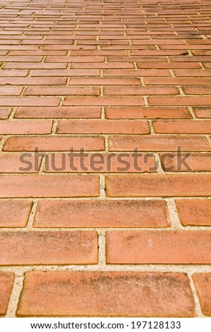 A tall wall made of bricks and mortar.