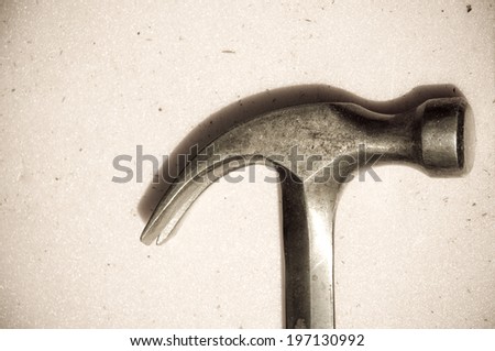 A metal silver hammer showing the head and the claw.