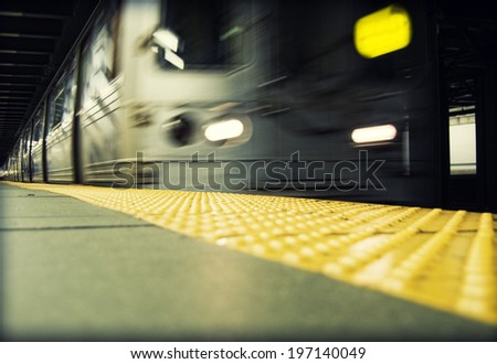 A distorted image of a subway train passing by.