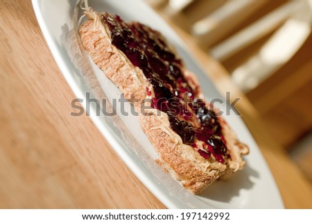 A piece of toast with jam spread on it.