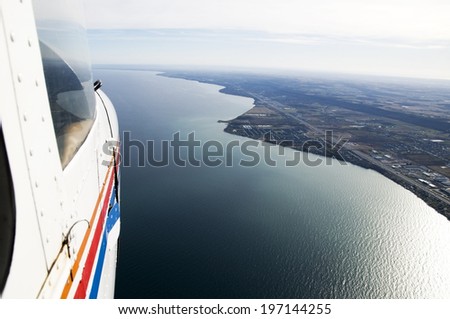 An airplane flying above a body of water.