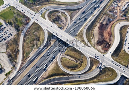 A busy highway with cars traveling in multiple directions.