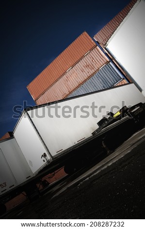 Shipping containers and truck trailers with Dutch tilt
