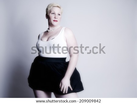 Smiling woman in tank-top and skirt