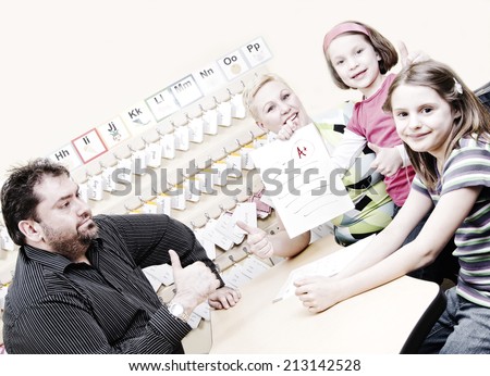 Girl showing off good grades at parent-teacher conference