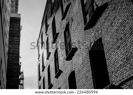 Urban loft in twilight alley. Black and white.