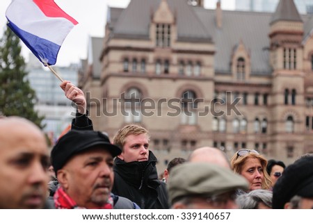 Toronto November 14, 2015
Crowds gather at Toronto's Nathan Phillips Square for a silent vigil this afternoon to honour those lost and injured in the terror attacks on Paris.