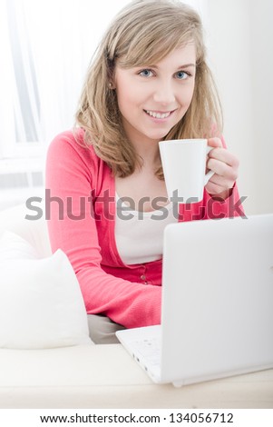 Home Office, happy woman using laptop computer at home