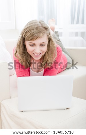 Home Office, happy woman using laptop computer at home
