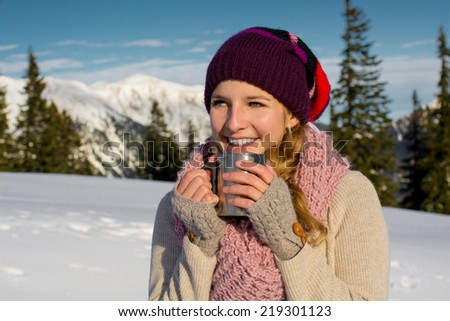 Beautiful Happy Smiling Winter Woman with Mug Outdoor.