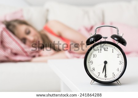 Sleepy young woman in bed