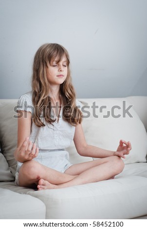 young girl sitting in a yoga position