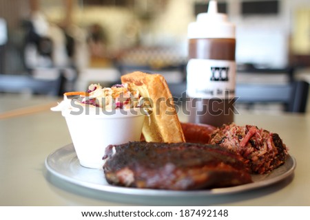 Barbecue plate with pork ribs, beef brisket, and Texas toast.