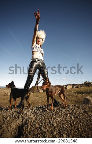 Young alternative woman with her two dogs.