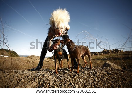 Young alternative woman with her two dogs.
