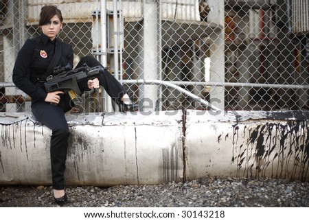 A sexy and armed woman with a badge.