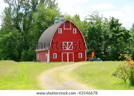 A red barn on a farm.