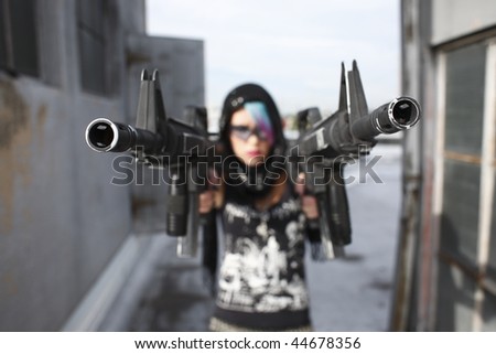 Sexy alternative woman with assault rifles