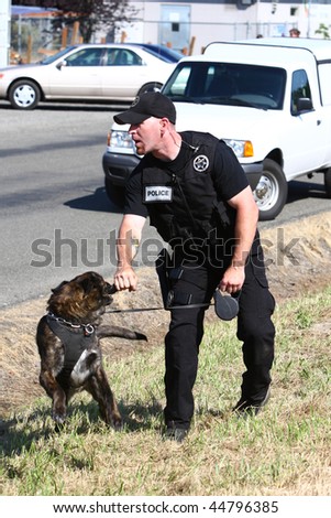 Police officer with a police dog.
