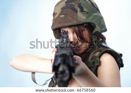 Sexy army woman with rifle.