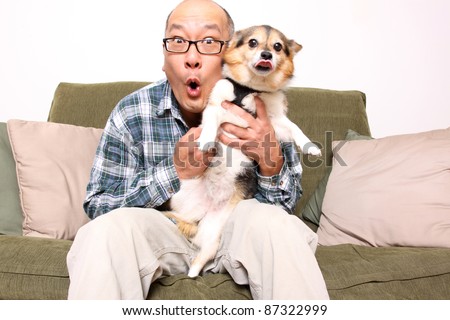 Asian man with pet dog.