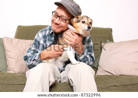 Asian man with pet dog.