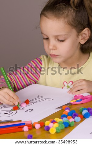 Little Girl Drawing a picture of a the ginger bread man