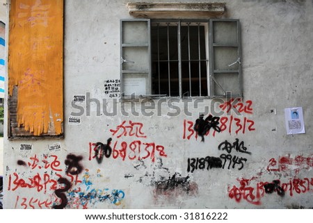 Graffiti and old window on the wall