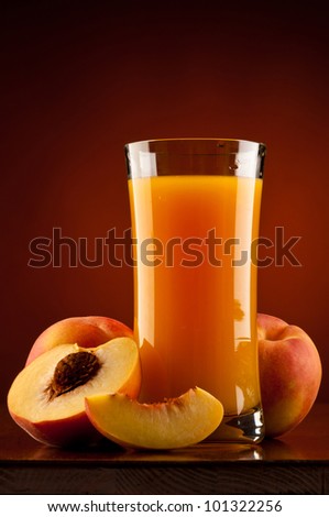 peach juice drink with fresh ripe peaches