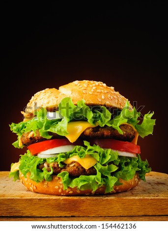 fast food with big tasty traditional double cheeseburger or hamburger