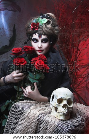 Spanish woman. Young woman in dramatic artistic image with rose\'s and skull