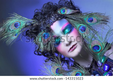 Woman - peacock. Young lady in vintage creative image.