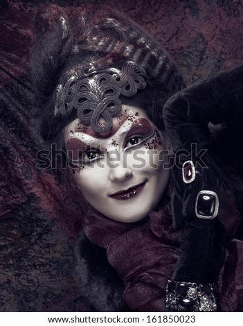 Young plump woman in creative image  in russian style  with artistic red and white visage